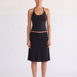 Woman wearing the Madison Skirt black scallop waist skirt, front view