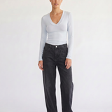Woman wearing the Margaux baby blue deep v henley top, front view