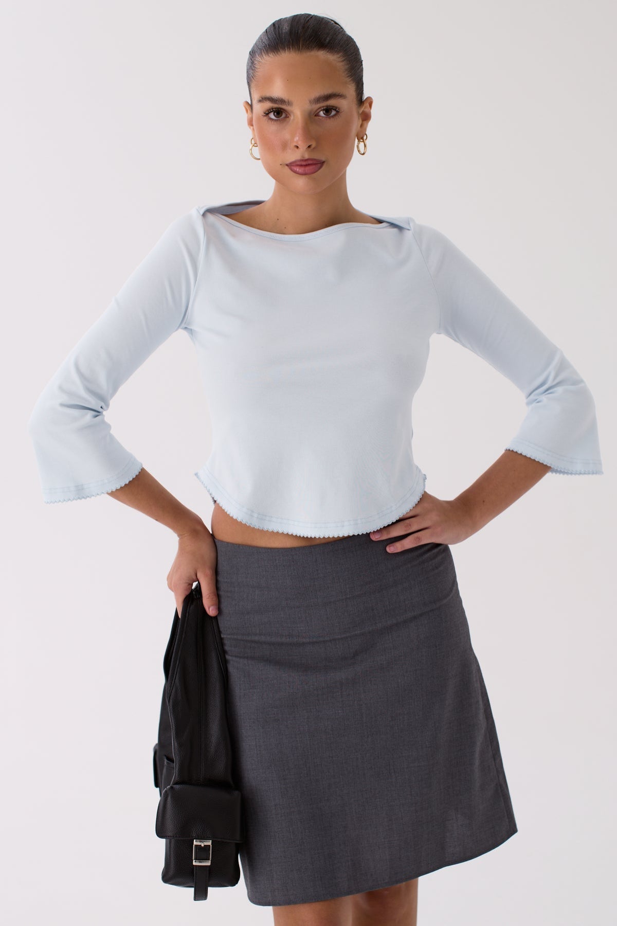 Model wearing the Lola blue cotton top outdoors