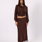 Woman wearing the Clara brown knit cardigan, front view