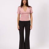Woman wearing the Tailored Flare Pant charcoal flare pants, front view
