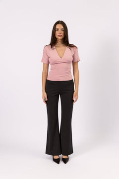 Woman wearing the Mila rose deep v tee, front view