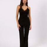 Woman wearing the Isla black lace trim cami, front view
