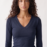 Margaux Deep V Henley Top in navy — model wearing the soft stretch henley with deep V neckline