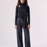 Wren Top in black — front view of the soft knit long-sleeve top with attached draped scarf